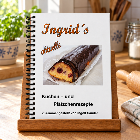 Ingrids aktuelle Kuchen und Plätzchenrezepte auf einem hölzernen Buchständer in einer hellen Küche